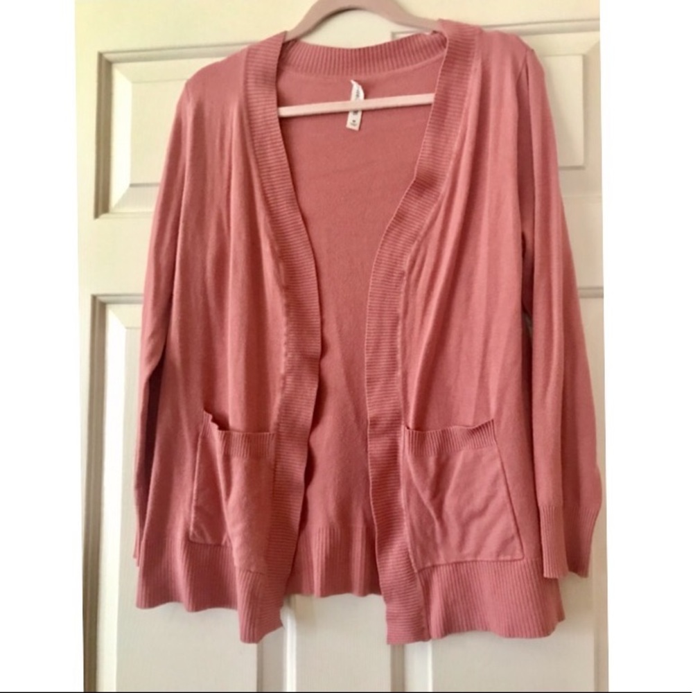 Pink cardigan in size medium.